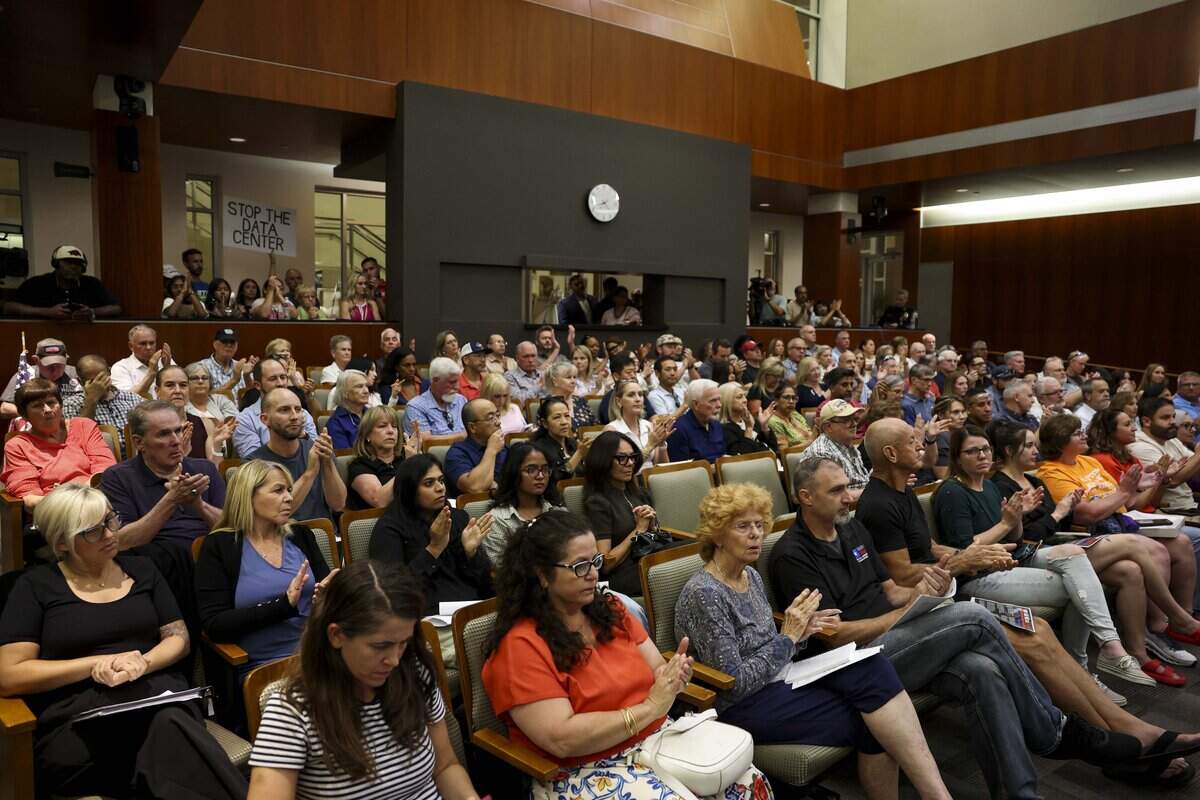 Community members pack into the Keller City Council chambers for a meeting to voice their concerns over a planned data center in Westlake on Wednesday, Aug. 12, 2026 in Keller. The chambers hit capacity at the start of the meeting pushing some people into an overflow space.