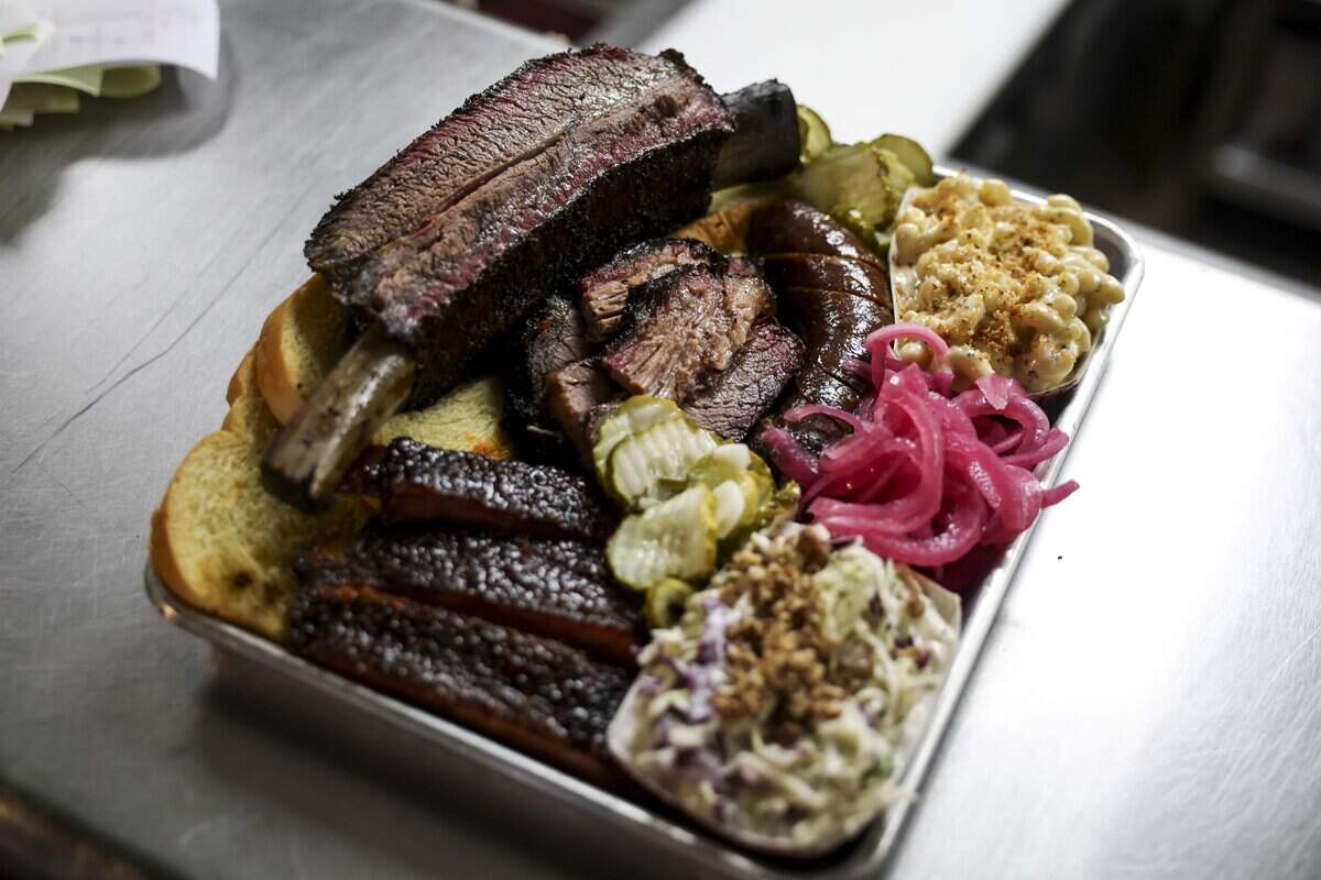 A tray of barbecue and sides is served up at Dayne's Craft Barbecue on Saturday, Aug. 15, 2026 in Aledo.