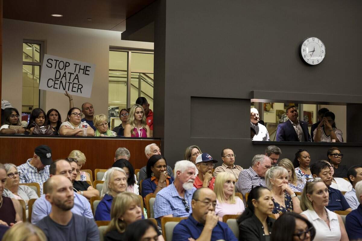 People listen to public comment over a planned data center in Westlake during Keller City Council on Wednesday, Aug. 12, 2026 in Keller.