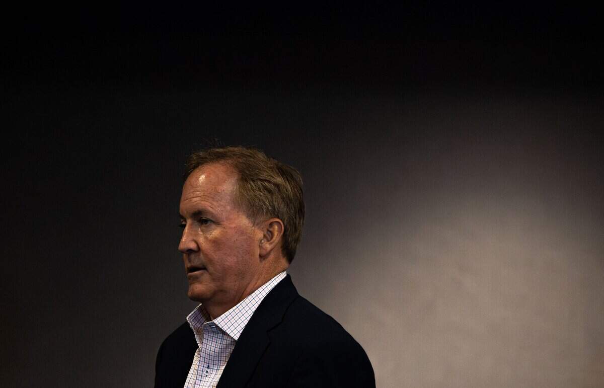 Texas Attorney General Ken Paxton walks towards the podium during a press conference event at Hampton Inn & Suites in Fort Worth on July 21, 2026.