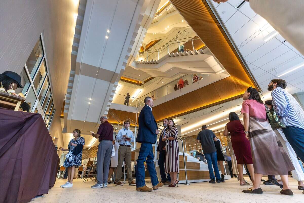 Attendees walk around the Texas A&M Law and Education Building during its grand opening in Fort Worth on Aug. 5, 2026.