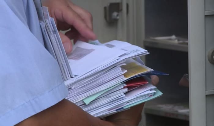 Five people, including three postal carriers charged in alleged multi-million dollar stolen check scheme