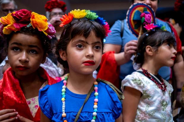 SAN ANTONIO, TEXAS - AUGUST 15: Cecilia Gonzales, 6, participates in a Guinness World Record attempt for the largest gathering of people dressed as Frida Kahlo during the 10th annual San Antonio Frida Fest on August 15, 2026 in San Antonio, Texas. Organizers counted 80 Kahlo look-alikes, not enough to surpass the 2017 largest recorded gathering of over 1,000 participants at the Dallas Museum of Art. (Photo by Joel Angel Juarez/Getty Images)