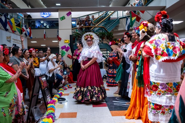 SAN ANTONIO, TEXAS - AUGUST 15: Mickie Trevino participates in a Guinness World Record attempt for the largest gathering of people dressed as Frida Kahlo during the 10th annual San Antonio Frida Fest on August 15, 2026 in San Antonio, Texas. Organizers counted 80 Kahlo look-alikes, not enough to surpass the 2017 largest recorded gathering of over 1,000 participants at the Dallas Museum of Art. (Photo by Joel Angel Juarez/Getty Images)
