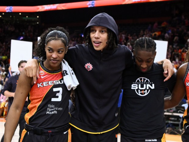 Ashlon Jackson, left, Brittney Griner, center, and Saniya Rivers of the Connecticut Sun celebrate after a game against the Los Angeles Sparks at the TD Garden on Aug. 18, 2026 in Boston. (Photo by Brian Fluharty/Getty Images)
