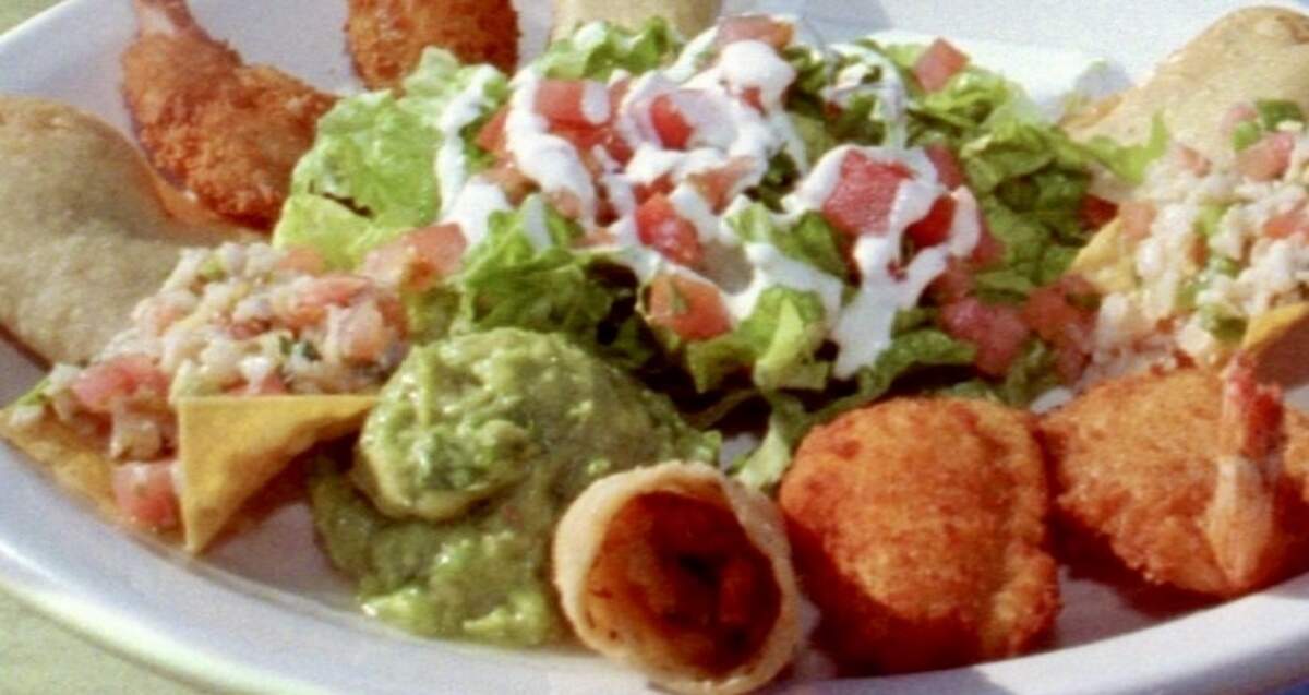 A combo platter with ceviche, shrimp, stuffed jalapeños, fish tacos, guacamole and sour cream at La Tortilandia.