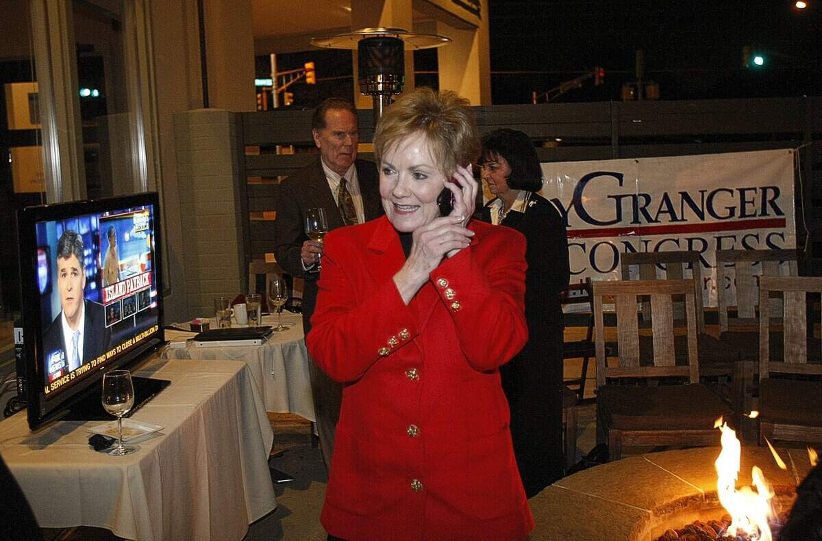 Representative Kay Granger talks on the phone with a supporter as she watches the returns for the Republican primary election at Winslow's Wine Cafe, Tuesday, March 2, 2010. (Fort Worth Star-Telegram/Rodger Mallison)