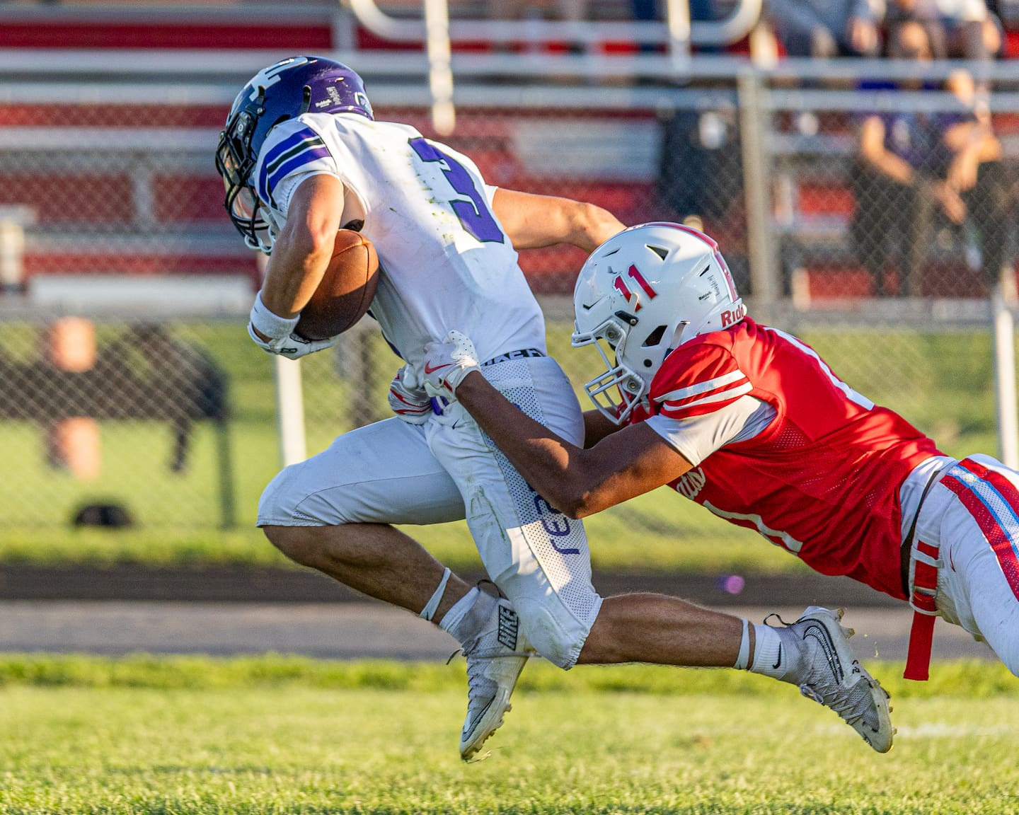 Ethan Taxis (3) of Plano runs ball as Diante Jones (11) of Ottawa grabs Taxis by his waist to tackle on Saturday, August 22, 2026 at King Field in Ottawa.