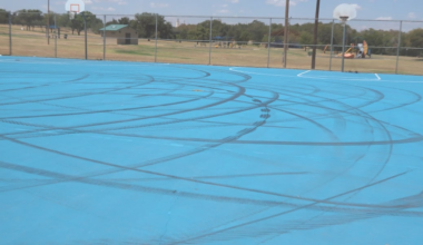 Driver covers court in tire tracks at Aztlan Park in North Lubbock