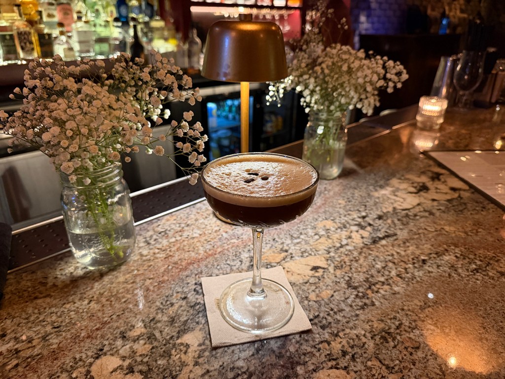 an espresso martini on a bar 