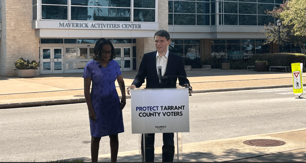 Talarico stands at a podium outside the Maverick Activities Center in Arlington, joined by County Commissioner Alisa Simmons.