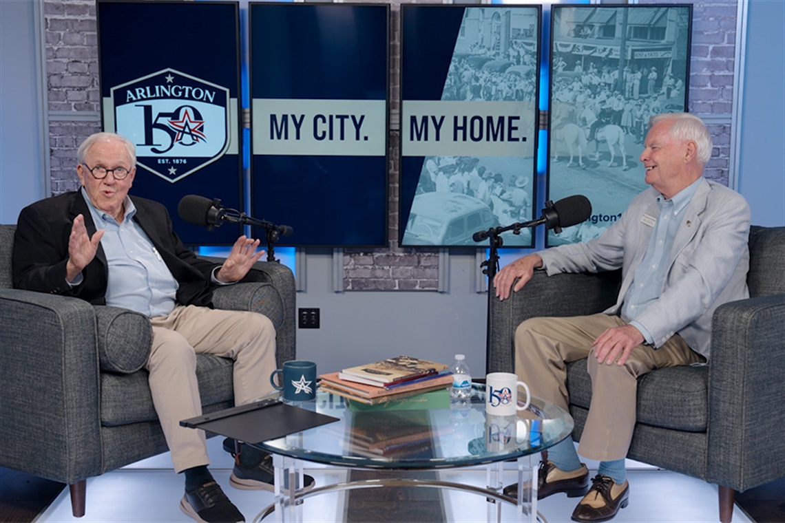 Host OK Carter talking and Jock Bethune smiling. 