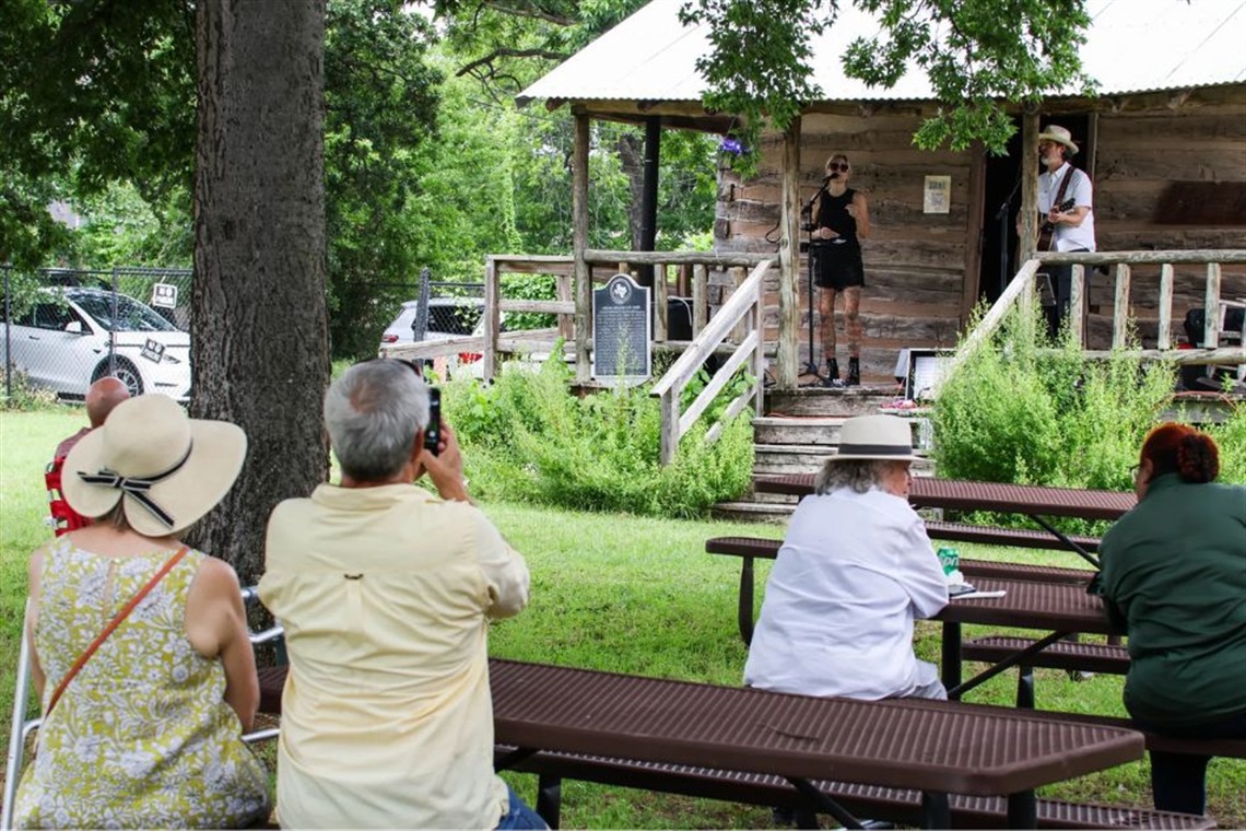 Musical performance outside at Knapp Heritage Park