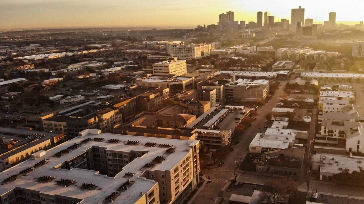 The sun sets in the West 7th neighborhood of Fort Worth in 2022. The sun sets in the West 7th neighborhood of Fort Worth in 2022.