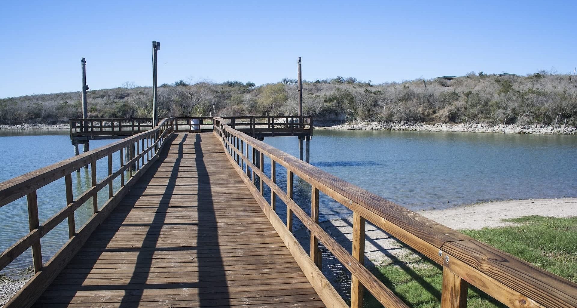 A wooden dock at a lake.