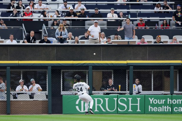 White Sox right fielder Braden Montgomery (24) chases a RBI double ball from Rangers center fielder Evan Carter (32) during the first inning at Rate Field Aug. 24, 2026 in Chicago. (Armando L. Sanchez/Chicago Tribune)