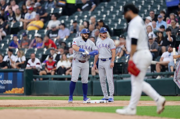 Rangers first baseman Jake Burger (21) stands at first after getting walked during the first inning against the White Sox at Rate Field Aug. 24, 2026 in Chicago. (Armando L. Sanchez/Chicago Tribune)