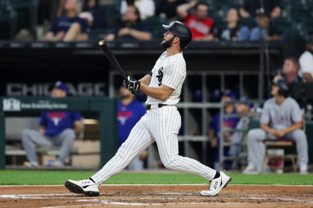 White Sox center fielder Tristan Peters (29) hits a two-run homer during the second inning against the Rangers at Rate Field Aug. 24, 2026 in Chicago. (Armando L. Sanchez/Chicago Tribune)