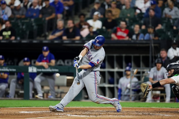 Rangers shortstop Corey Seager (5) hits a two RBI double during the third inning against the White Sox at Rate Field Aug. 24, 2026 in Chicago. (Armando L. Sanchez/Chicago Tribune)