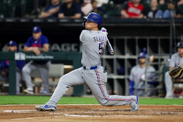 Rangers shortstop Corey Seager (5) hits a two RBI double during the third inning against the White Sox at Rate Field Aug. 24, 2026 in Chicago. (Armando L. Sanchez/Chicago Tribune)