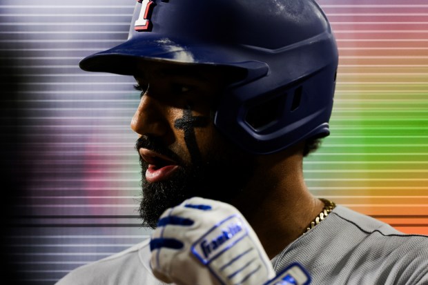 Rangers shortstop Ezequiel Duran (20) talks with Rangers first baseman Jake Burger (21) after Duran struck out during the fourth inning against the White Sox at Rate Field Aug. 24, 2026 in Chicago. (Armando L. Sanchez/Chicago Tribune)