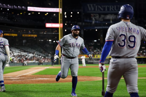 Rangers first baseman Jake Burger (21) celebrates after hitting a solo homer during the fifth inning against the White Sox at Rate Field Aug. 24, 2026 in Chicago. (Armando L. Sanchez/Chicago Tribune)