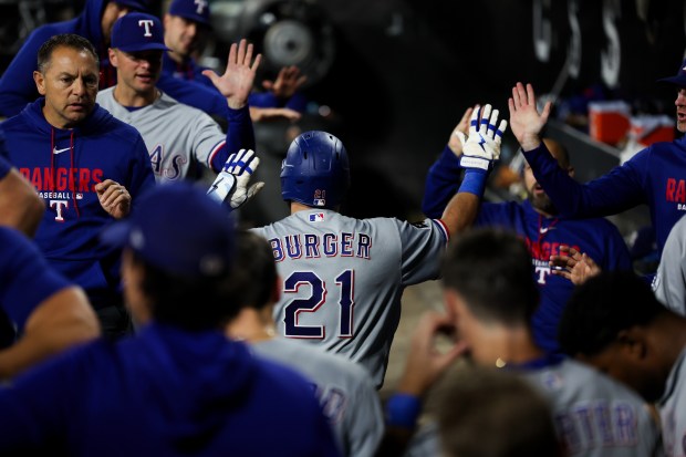 Rangers first baseman Jake Burger (21) celebrates after hitting a solo homer during the fifth inning against the White Sox at Rate Field Aug. 24, 2026 in Chicago. (Armando L. Sanchez/Chicago Tribune)