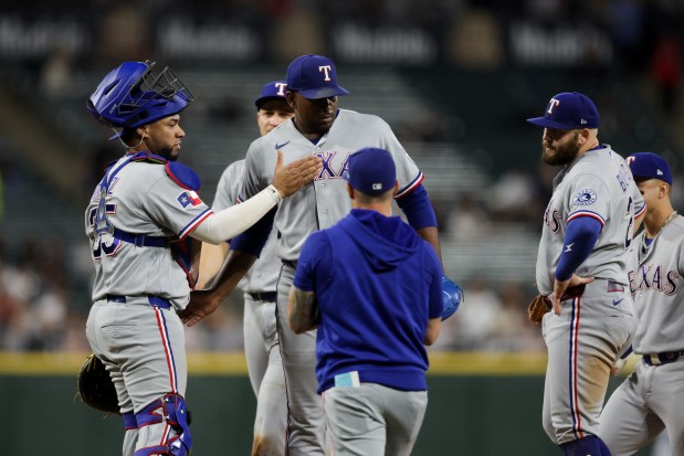 Rangers manager Skip Schumaker takes out Rangers pitcher Kumar Rocker (80) during the sixth inning against the White Sox at Rate Field Aug. 24, 2026 in Chicago. (Armando L. Sanchez/Chicago Tribune)