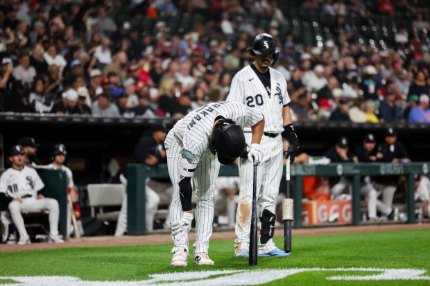 White Sox first baseman Munetaka Murakami (5) leans over after hitting himself with a ball during the fifth inning against the Rangers at Rate Field Aug. 24, 2026 in Chicago. (Armando L. Sanchez/Chicago Tribune)