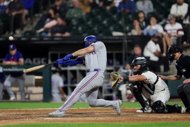 Rangers left fielder Wyatt Langford (36) hits a two-run homer during the ninth inning against the White Sox at Rate Field Aug. 24, 2026 in Chicago. (Armando L. Sanchez/Chicago Tribune)