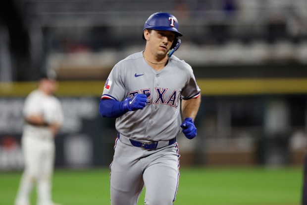Rangers left fielder Wyatt Langford (36) runs the bases after hitting a two-run homer during the ninth inning against the White Sox at Rate Field Aug. 24, 2026 in Chicago. (Armando L. Sanchez/Chicago Tribune)