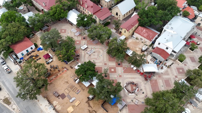 An aerial photograph shows the current state of Maverick Plaza as event producers prepare for Night in Old San Antonio (NIOSA).