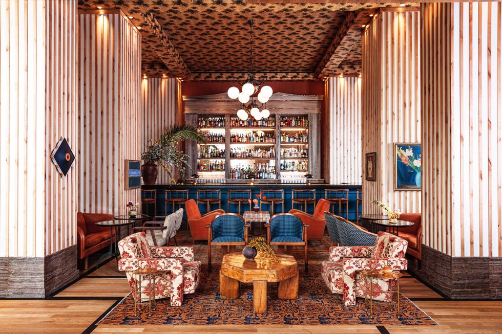 Stylish lounge area with a bar and unique seating.