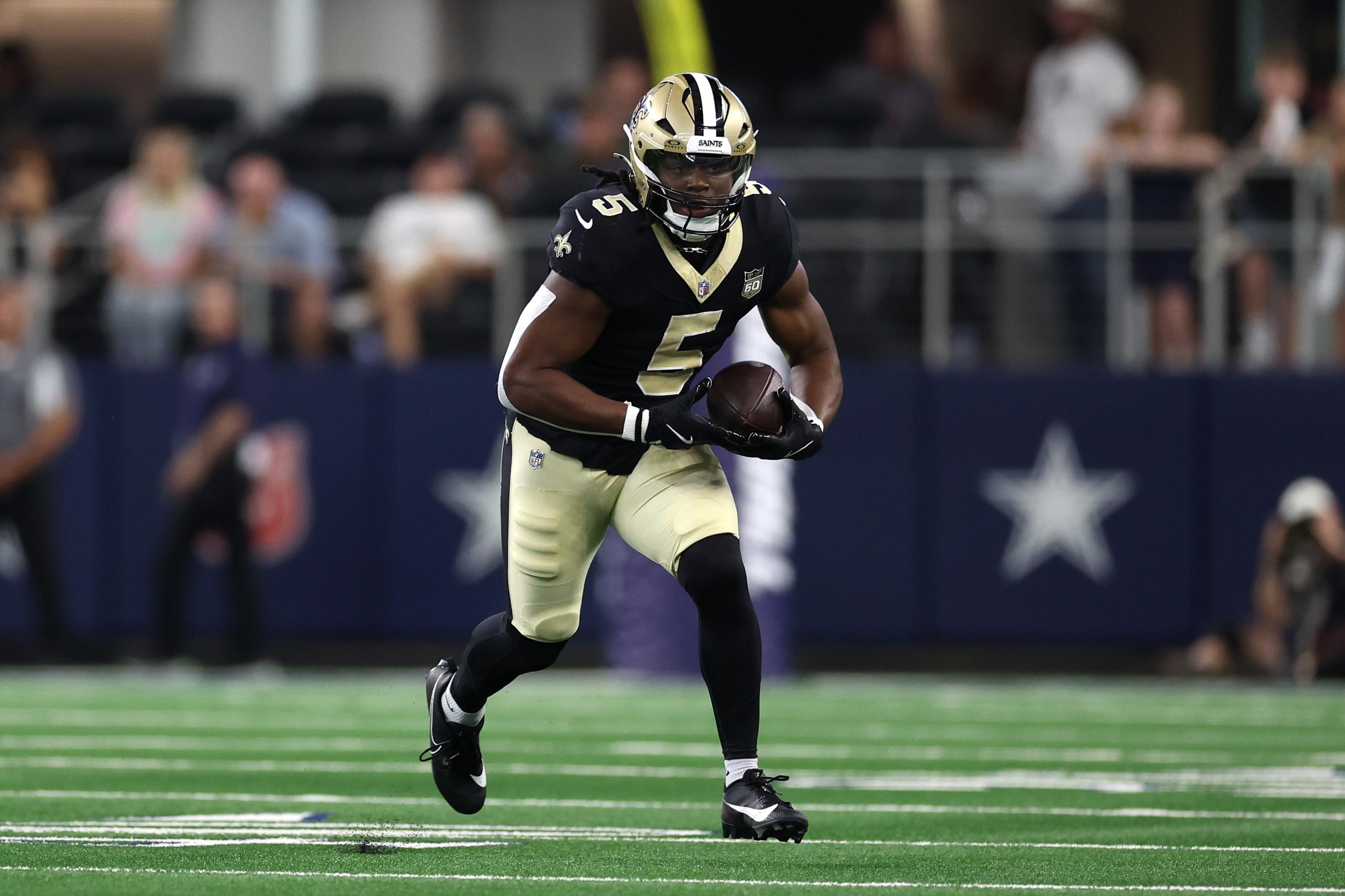 ARLINGTON, TEXAS - AUGUST 28: Kendre Miller #5 of the New Orleans Saints runs with the ball during the first quarter of the 2026 NFL preseason game against the Dallas Cowboys at AT&T Stadium on August 28, 2026 in Arlington, Texas. (Photo by Sam Hodde/Getty Images)