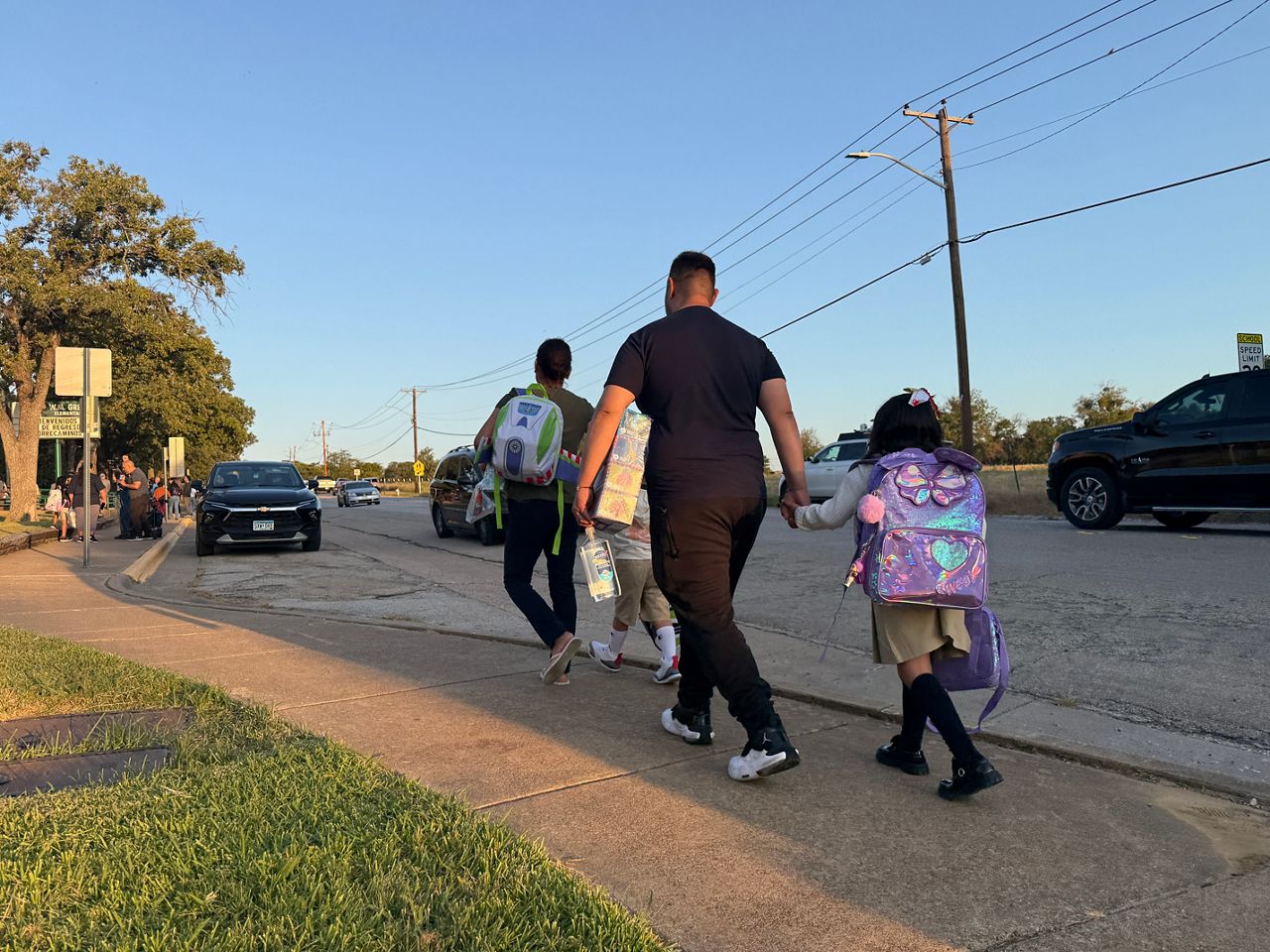 Parents walking their children to school on the first day of the 2026-27 school year on Monday, Aug. 10, 2026 at W.M. Green Elementary School. (Spectrum News 1/Lauren Rangel)