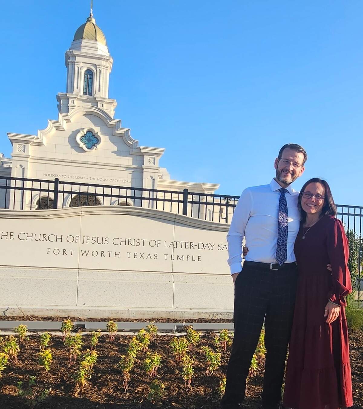 Burleson Relief Society President Lydia Holt and her husband Justin standing outside the new Church of Jesus Christ of Latter-day Saints temple in Fort Worth.