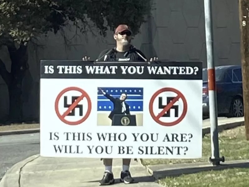 Man goes viral for holding up anti-Nazi, anti-Elon sign along San Antonio’s U.S. Highway 281