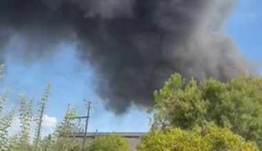 Firefighters battle blaze after at least 30 cars catch fire in Grand Prairie, officials say