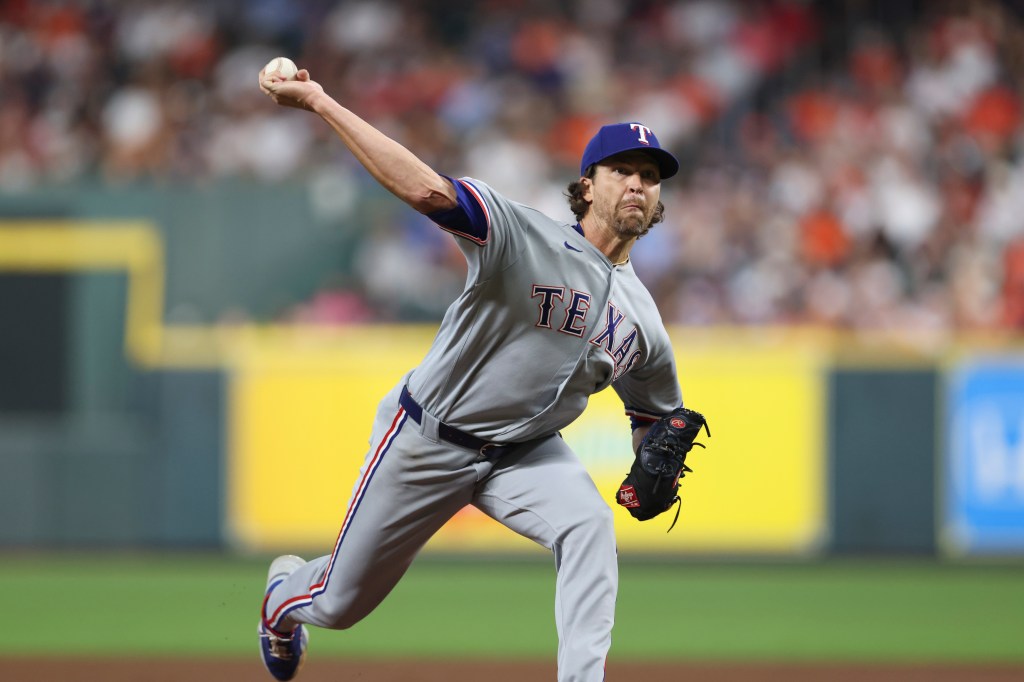 Texas Rangers pitcher Jacob DeGrom delivers a pitch during a game against the Houston Astros.