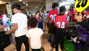 Thousands of Arlington ISD students get free backpacks, haircuts at back-to-school event