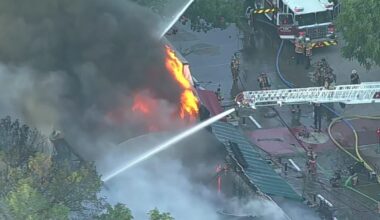 Arlington firefighters work to contain structure fire in 2400 block of West Abram Street