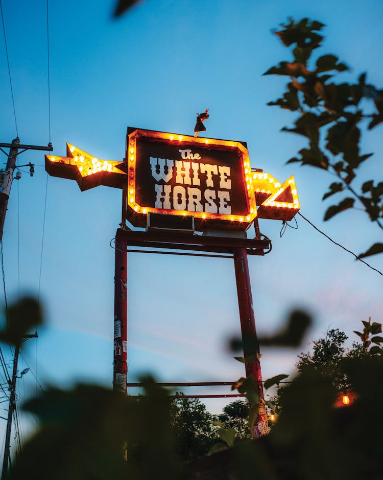 photo of white horse sign