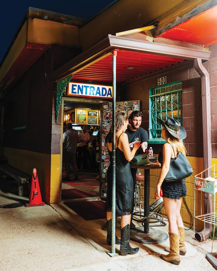 photo of people outside honky tonk entrance