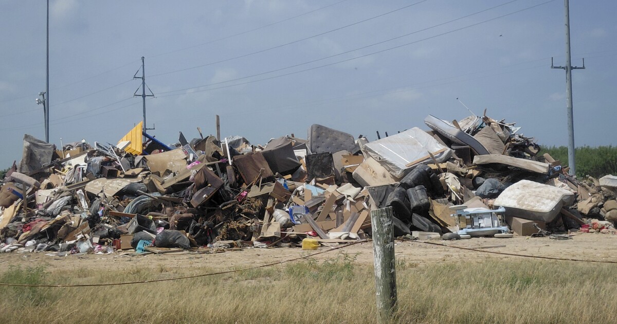 In this flood-ravaged South Texas town, residents are rebuilding while waiting for federal aid