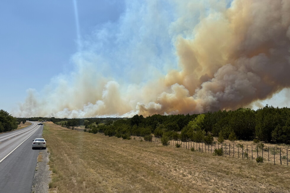 Texas wildfire forces evacuations while Reno fire slows