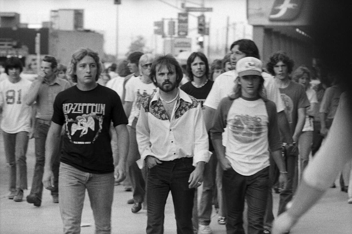 Led Zeppelin fans are pictured ahead of the Led Zeppelin concert at the Tarrant County Convention Center on May 22, 1977.
