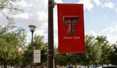 A Texas Tech University banner hangs from a light pole on the university’s campus in Lubbock, Texas.