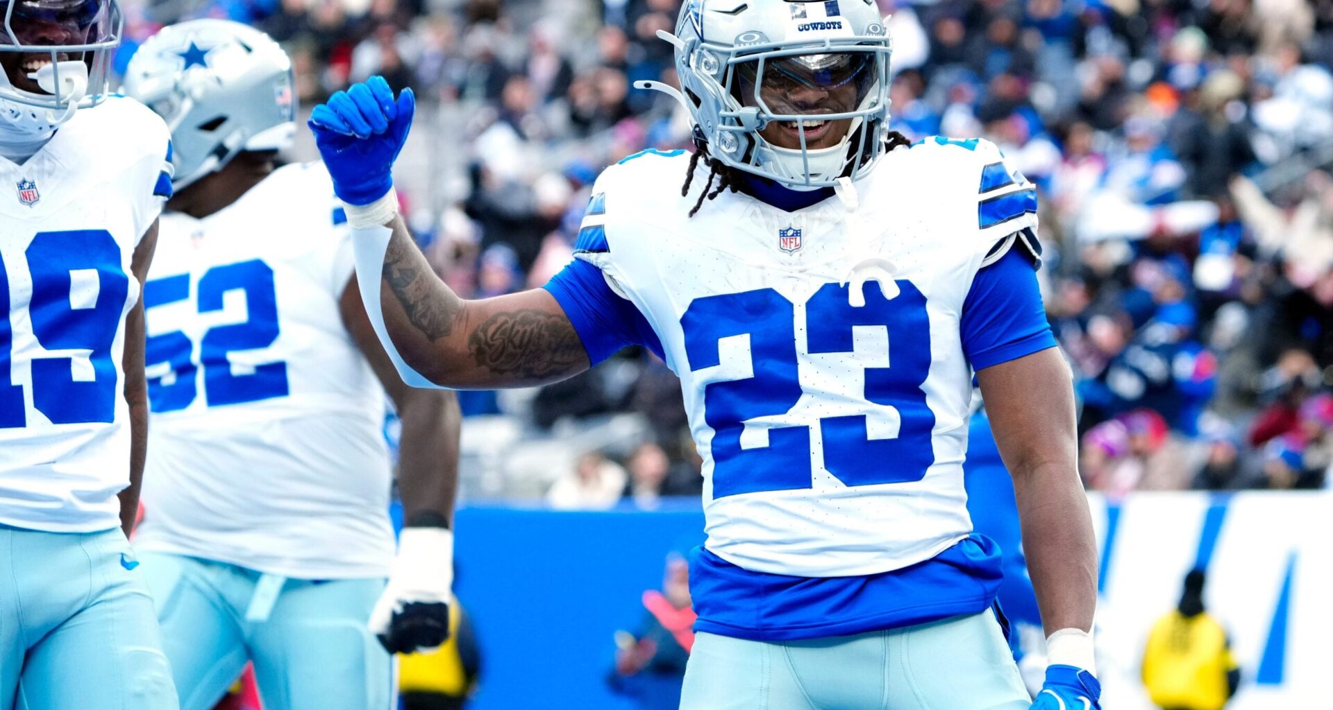 Dallas Cowboys running back Jaydon Blue (23) celebrates after scoring the first touchdown of the game, Sunday, January 4, 2026, in East Rutherford.