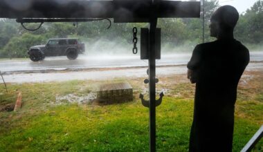 Edouard, now a tropical depression, drenches Texas with flash flooding and downed trees