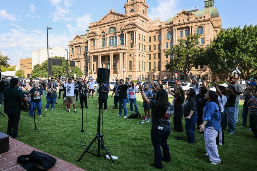 People gathered outside to sing in honor of Charlie Kirk before commissioners court passed a resolution honoring his life Tuesday, Sept. 1. 2026, in Fort Worth.